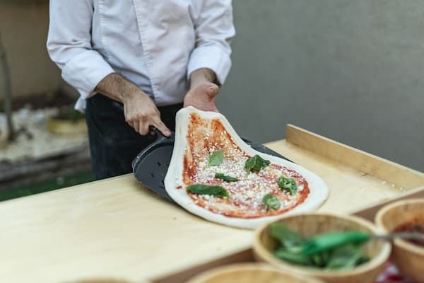Pizza making skill progression from beginner to expert showing pizza craftsmanship and mastery techniques